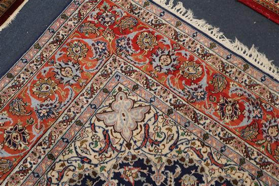 A Tabriz blue medallion rug 222 x 156cm.